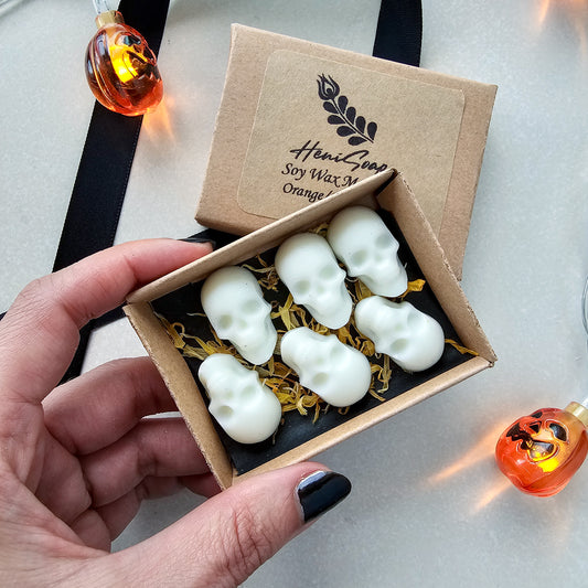 Box of white skull-shaped soy wax tart