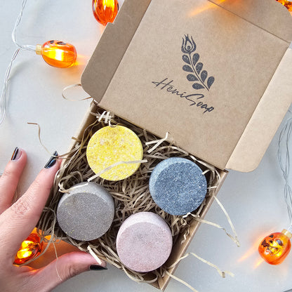 Box of colorful shower steamers with 'Heni Goop' branding on a light background.